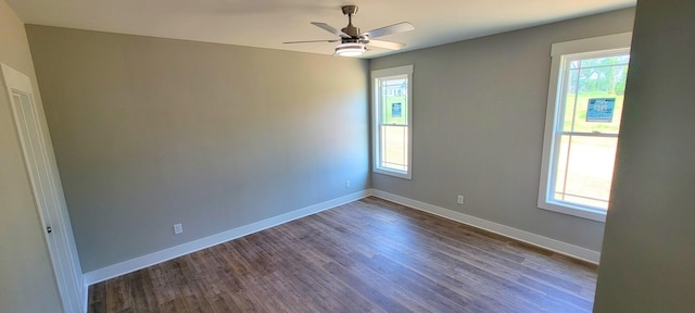 unfurnished room featuring dark hardwood / wood-style floors and ceiling fan