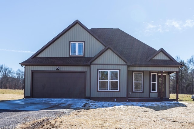 view of front of property featuring a porch and a garage