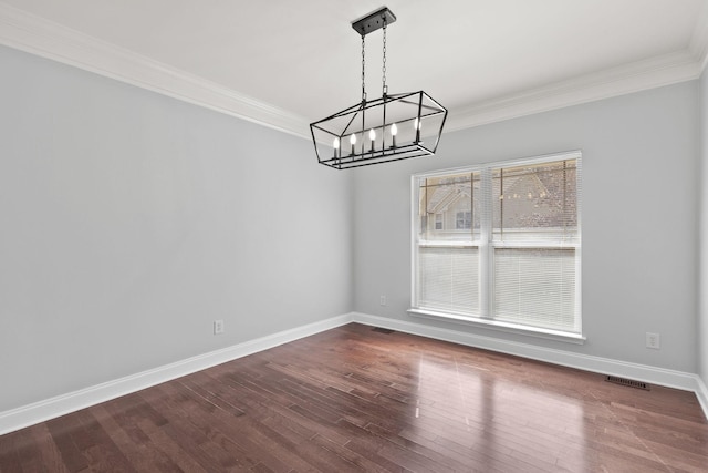 unfurnished dining area with crown molding, wood-type flooring, and a chandelier