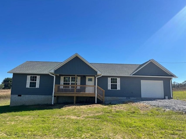 ranch-style home with a garage, a front lawn, and a porch