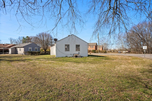 view of property exterior featuring a lawn