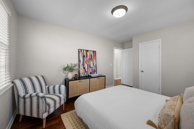 bedroom featuring dark hardwood / wood-style flooring