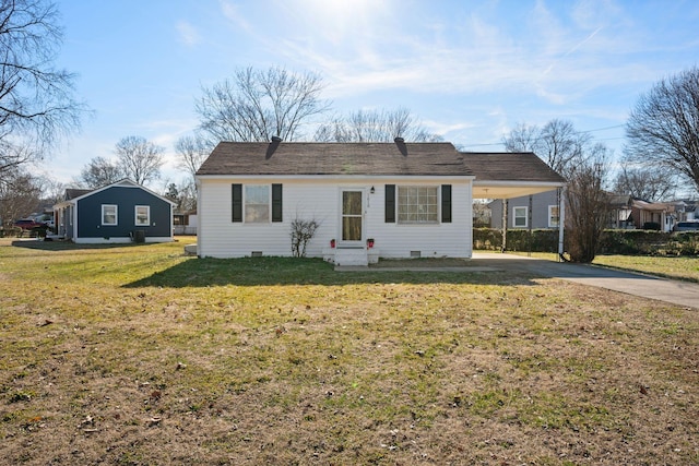 ranch-style home with a carport and a front yard