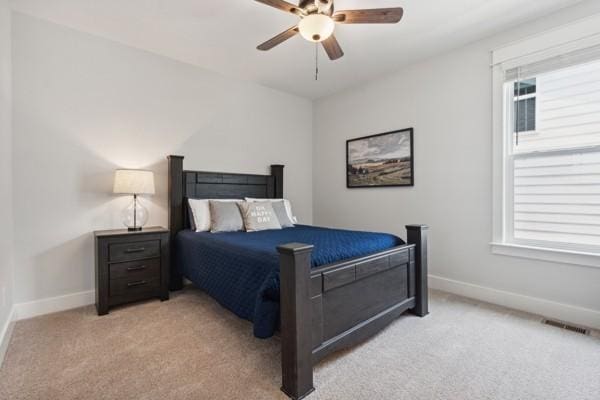 bedroom with light colored carpet and ceiling fan