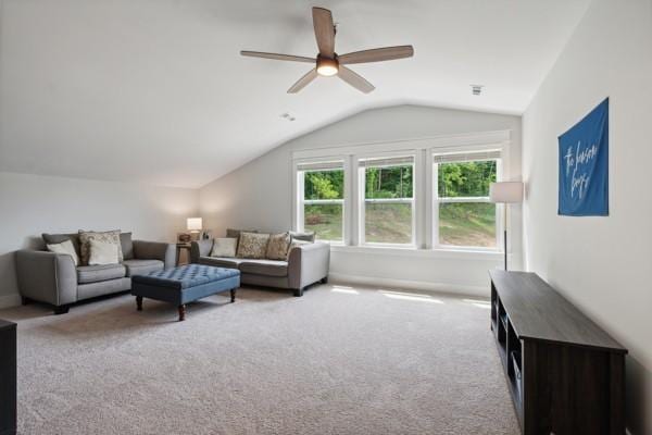 carpeted living room featuring vaulted ceiling and ceiling fan