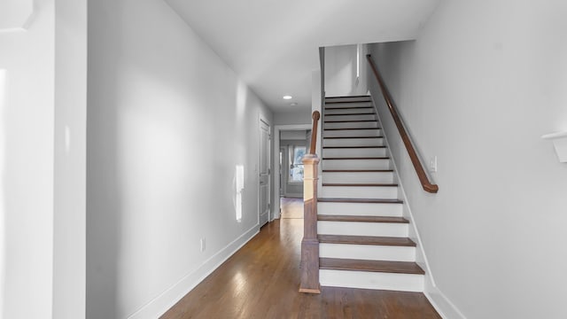 staircase featuring hardwood / wood-style flooring