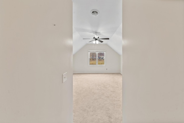 bonus room with ceiling fan, lofted ceiling, and light carpet