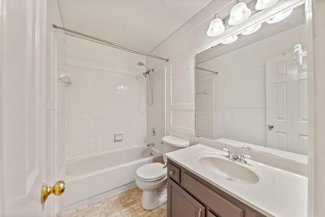 full bathroom featuring tiled shower / bath, vanity, and toilet