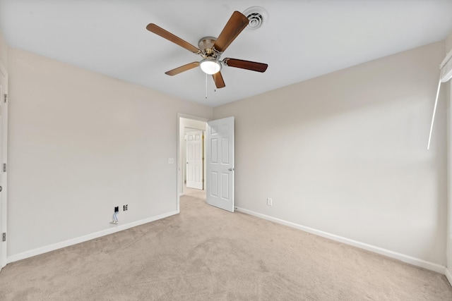 carpeted empty room with ceiling fan