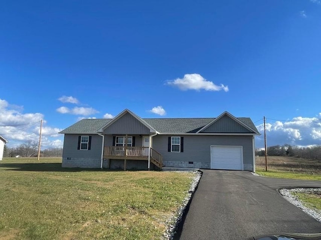 view of front of property featuring a porch, a garage, and a front lawn