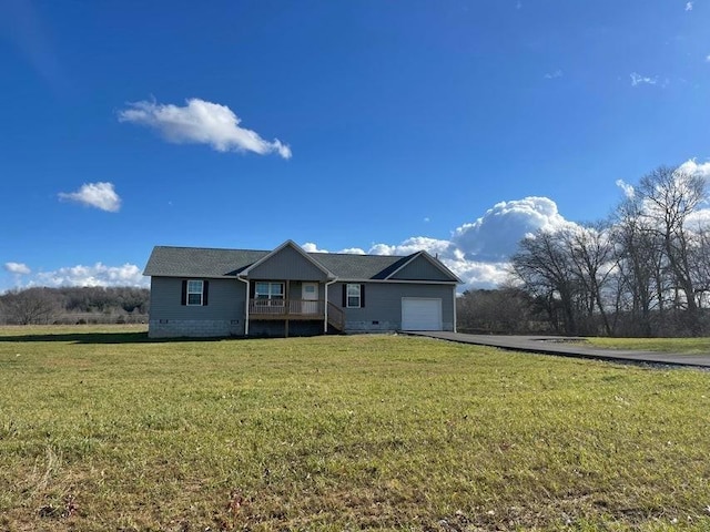 view of front of home with a garage and a front yard