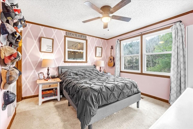 carpeted bedroom featuring ornamental molding, ceiling fan, and a textured ceiling