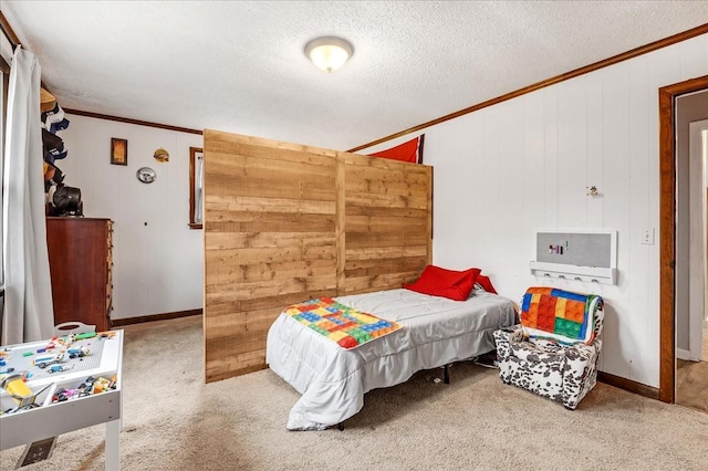 carpeted bedroom featuring crown molding and a textured ceiling