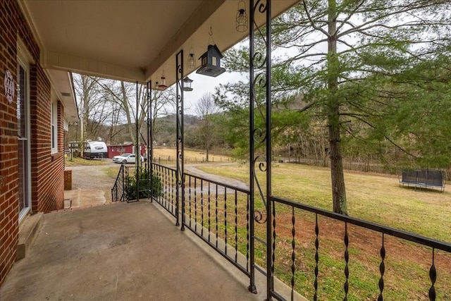 view of patio / terrace with covered porch and a trampoline