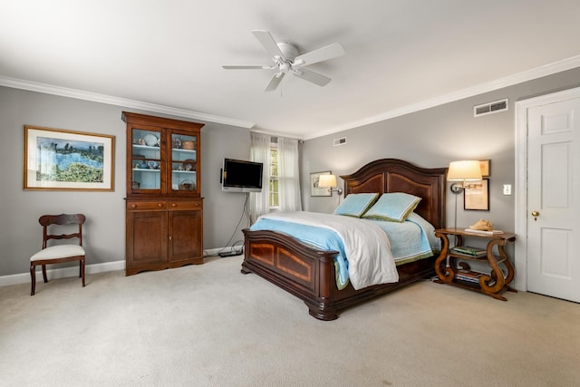 carpeted bedroom featuring crown molding and ceiling fan