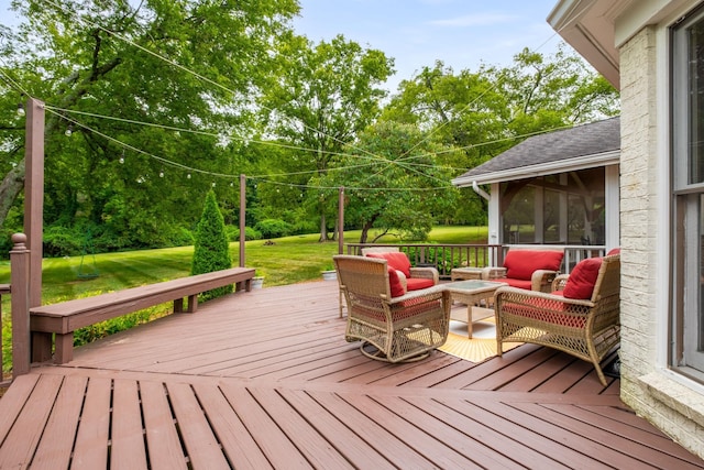 wooden terrace featuring a yard, an outdoor hangout area, and a sunroom