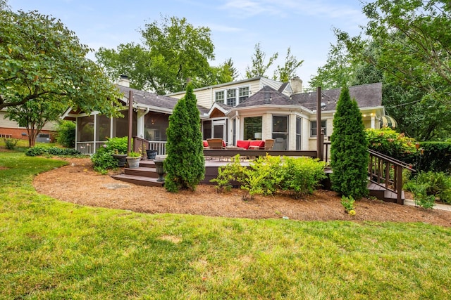 view of front of home with a sunroom and a front lawn