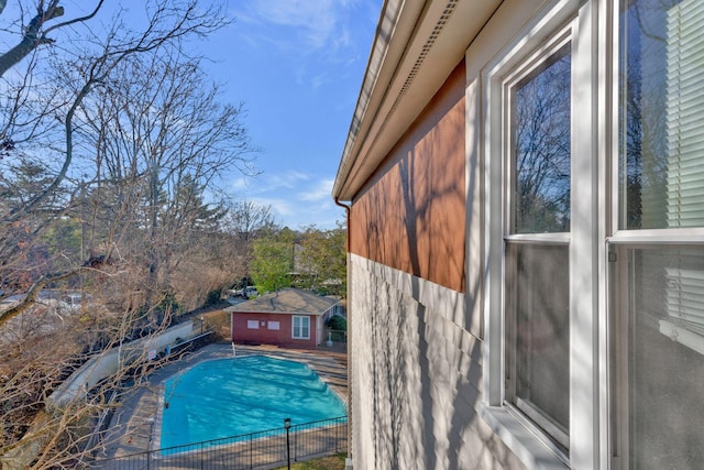 view of pool with an outdoor structure