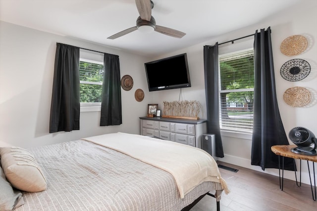 bedroom featuring ceiling fan and light wood-type flooring