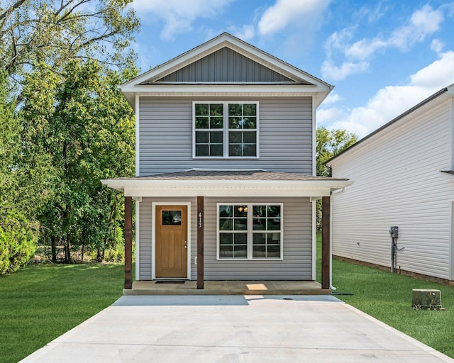 view of property featuring a front lawn