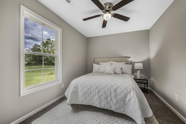 carpeted bedroom featuring ceiling fan