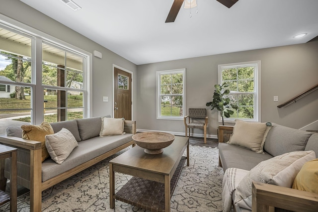 living room featuring ceiling fan, a healthy amount of sunlight, and light hardwood / wood-style floors