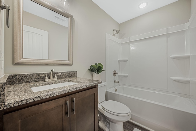 full bathroom featuring toilet, vanity, and shower / bathing tub combination