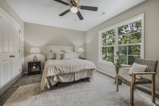 bedroom with ceiling fan and carpet flooring