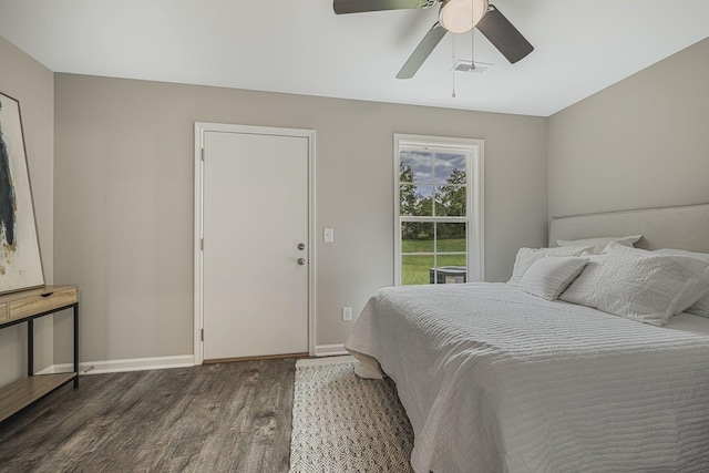 bedroom featuring dark hardwood / wood-style floors and ceiling fan