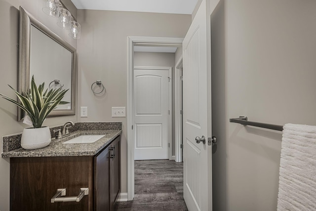 bathroom with vanity and hardwood / wood-style floors