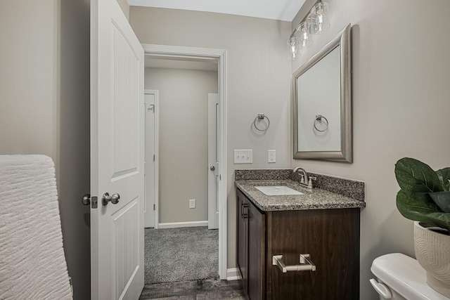 bathroom with vanity and toilet