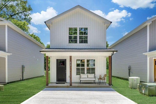 rear view of house with a lawn