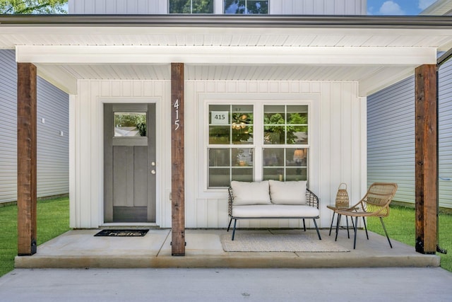 property entrance with covered porch