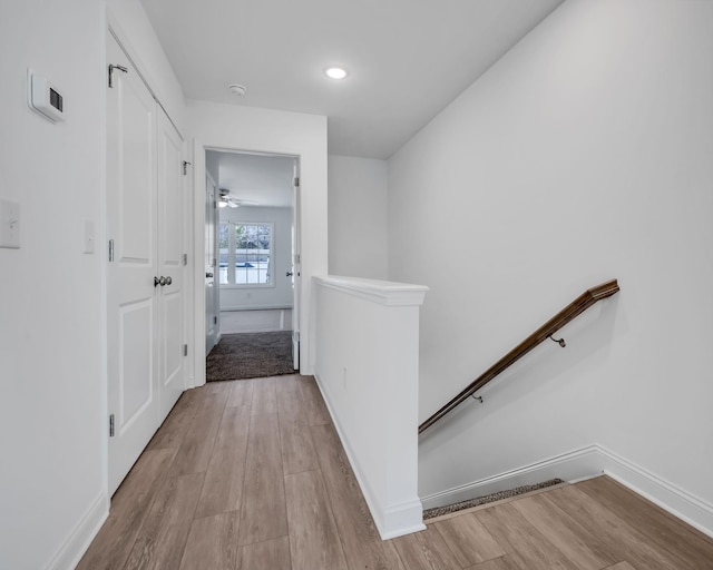 hall with light hardwood / wood-style flooring