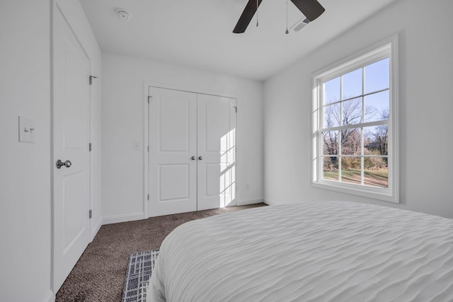 carpeted bedroom with a closet and ceiling fan