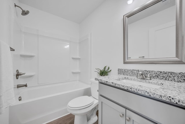 full bathroom featuring shower / bathing tub combination, vanity, hardwood / wood-style floors, and toilet