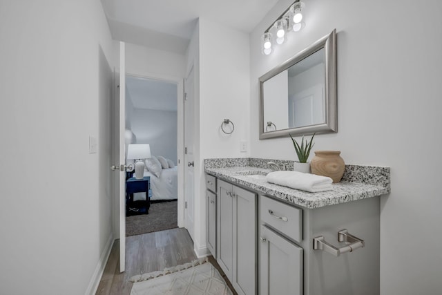 bathroom featuring vanity and hardwood / wood-style floors