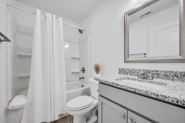 full bathroom featuring vanity, toilet, and shower / tub combo with curtain