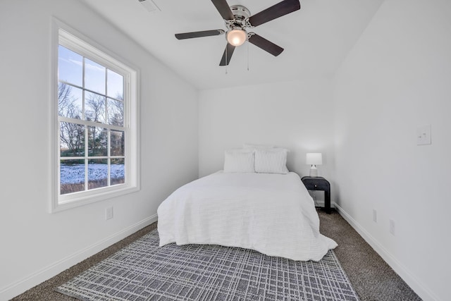 bedroom featuring ceiling fan and dark colored carpet