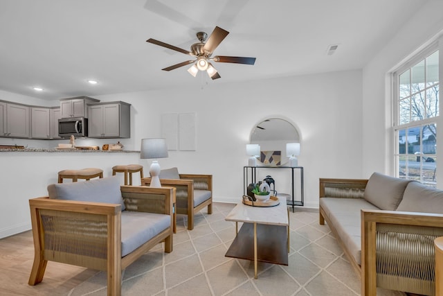 living room featuring ceiling fan