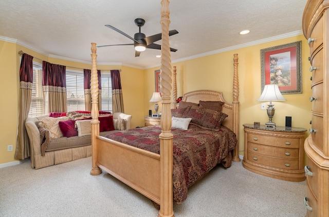 carpeted bedroom with ceiling fan, crown molding, and a textured ceiling