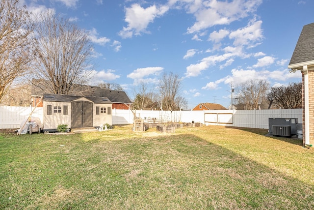 view of yard with central AC and a storage unit