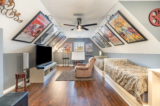 interior space with vaulted ceiling, dark hardwood / wood-style floors, and a textured ceiling