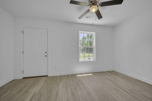 spare room featuring ceiling fan and light wood-type flooring