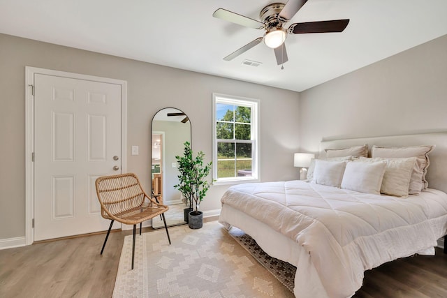 bedroom featuring ceiling fan and light hardwood / wood-style flooring