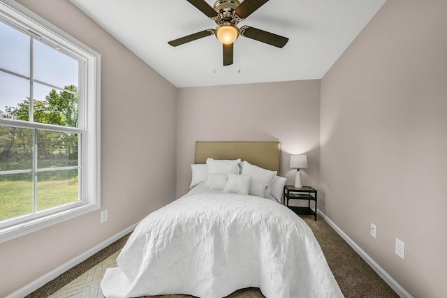 carpeted bedroom featuring ceiling fan