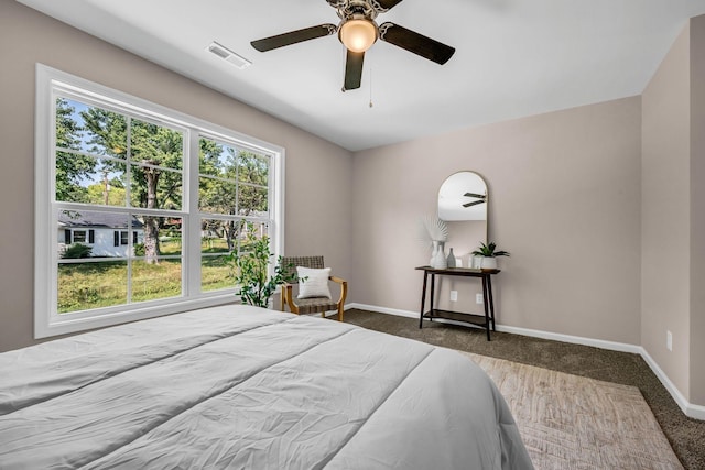 carpeted bedroom featuring ceiling fan