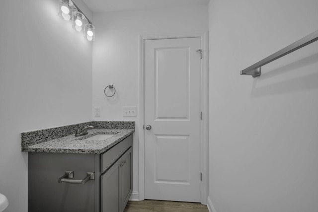 bathroom with vanity and hardwood / wood-style floors