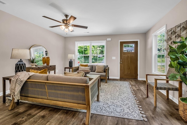 living room with hardwood / wood-style flooring and ceiling fan