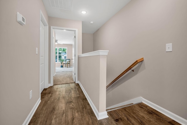 hallway with dark hardwood / wood-style floors